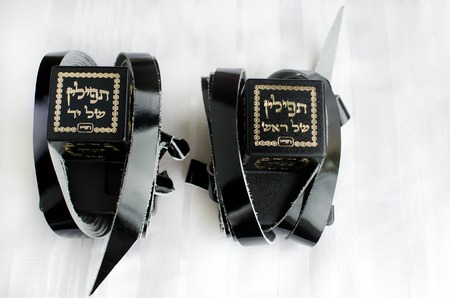A set of tefillin includes the arm-tefillin (left)and the head-tefillin on Talit.の写真素材