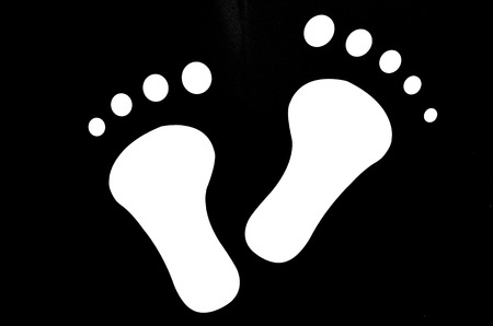 Black and white human foot sign.の写真素材
