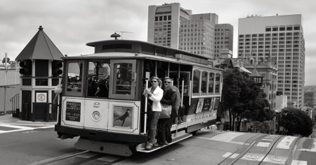 SAN FRANCISCO - MAY 21 2015:Passengers riding on Powell-Hyde line cable car in San Francisco, CA.San Francisco cable car system is the world's last manually operated cable car system.のeditorial素材