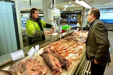 AUCKLAND - JULY 08 2015:Trade in Auckland Fish Market in Auckland New Zealand.The Fish Market building, hosts fresh seafood retailers, a boutique food market, restaurants and Auckland Seafood School.のeditorial素材