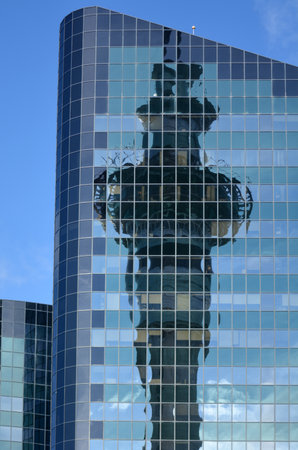 AUCKLAND,  NZL -  AUG 01 2015:Auckland Sky Tower reflection on office building windows. At 328 metres, the Sky Tower is the tallest man-made structure in New Zealandのeditorial素材