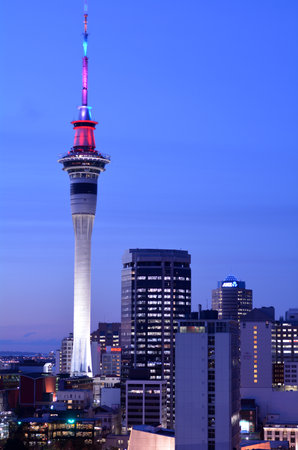 AUCKLAND - AUG 03 2015:Urban view of Auckland Sky tower in colors at dusk. The Sky Tower is the tallest structure in the Southern Hemisphere at 328 metres.のeditorial素材
