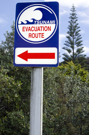 Tsunami evacuation route sign in a coastal area.の写真素材