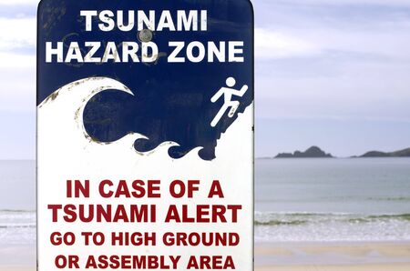 Tsunami evacuation route sign in a coastal area.の写真素材