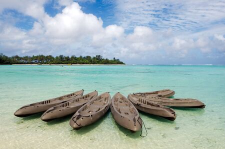 Group of empty kayaks over Muri Lagoon in Rarotonga Cook Islands.