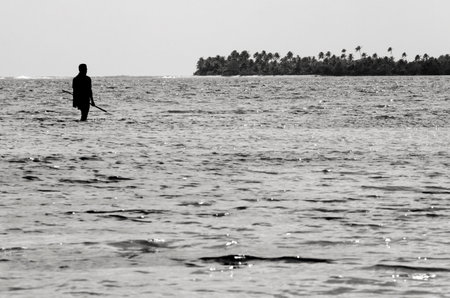 AITUTAKI - SEP 17:Cook Islander Spearfishing on Sep 17 2013.Spearfishing is an ancient method of fishing that has been used throughout the world for millennia.のeditorial素材