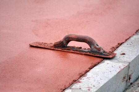 Finishing trowel tool during road work maintenance.の写真素材