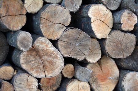 Firewood logs stacked up in a pile.