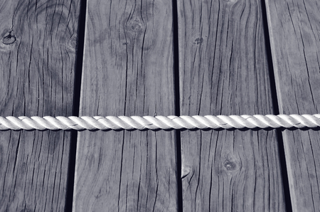 Tug of war on wooden planks background. business concept photo of  competition,
challenge, achievement, determination, endurance, success. (BW)の写真素材