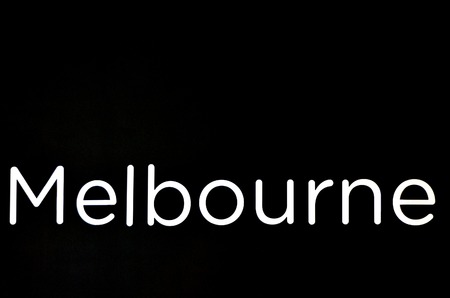 White Melbourne sign and symbol over black background. copy spaceの写真素材
