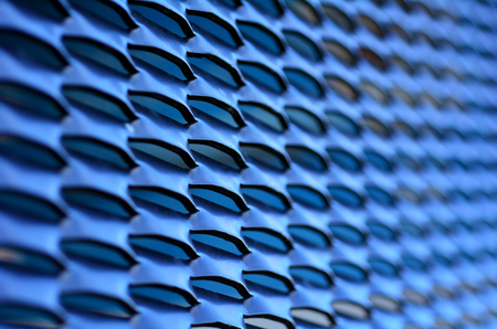 Pattern of metal holes grid background texture. close upの写真素材