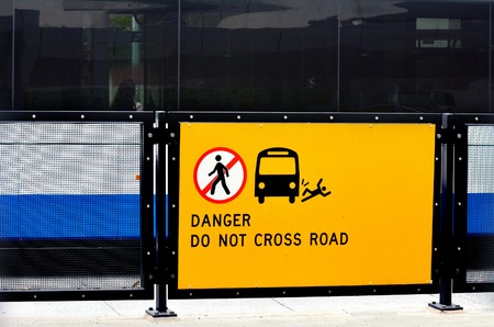 Danger do not cross road sign and symbol. concept photo
