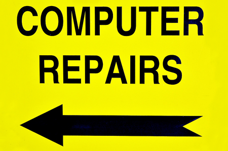 Computer repairs road sign with direction arrow.  Concept photo of computer repairs, business, problem,advice,maintenance and malfunction.の写真素材