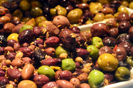 Mixed olives on display at the market.の写真素材