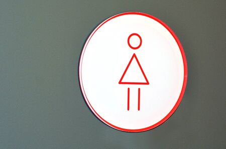 Women toilet sign on a background.の写真素材