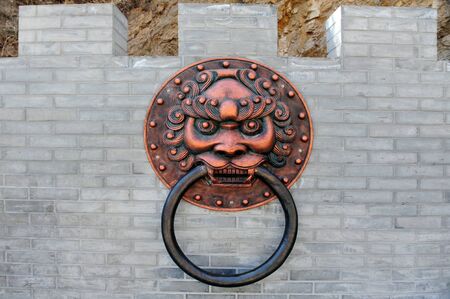 A Chinese dragon at the Great Wall of China.の写真素材