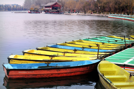 Dinghy boats on the white pagoda lake.のeditorial素材