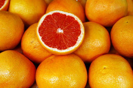 Red grapefruit on display in the market.の写真素材