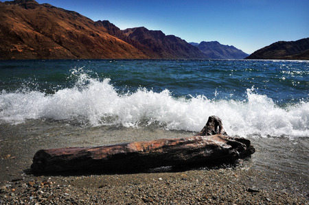 Lake Wakatipu is a long thin Z-shaped lake formed by glacial processes, and has spectacular views of nearby mountains.の写真素材