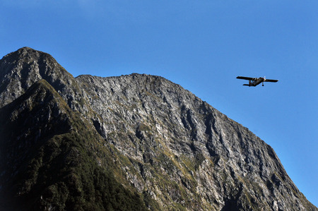 A tourist plane flies over Fiordland, southern New Zealand.