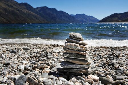 Lake Wakatipu is a long thin Z-shaped lake formed by glacial processes, and has spectacular views of nearby mountains.の写真素材