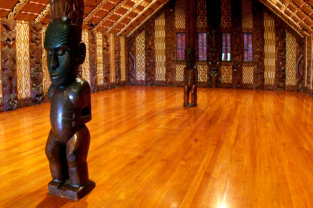 Interior view of the Maori carvings inside a meeting house (Marae) near the Treaty House in Waitangi, New Zealand.のeditorial素材