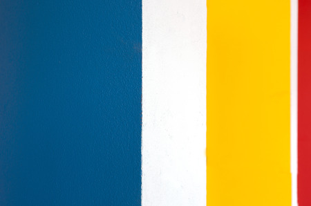 Square shape colorful in red, yellow, white and blue panted on a wall. Ready for your design, letters, symbols .の写真素材