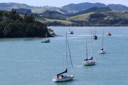 Aerial landscape view of Mangonui harbor with yachts and fishing boats in Northland New Zealand.の写真素材