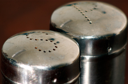 Close up of salt and pepper containersの写真素材