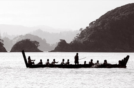 A traditional New Zealand Maori waka boat on the sea in the Bay of islands, New Zealand.のeditorial素材