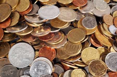 Mix of foreign coins from different countries.の写真素材