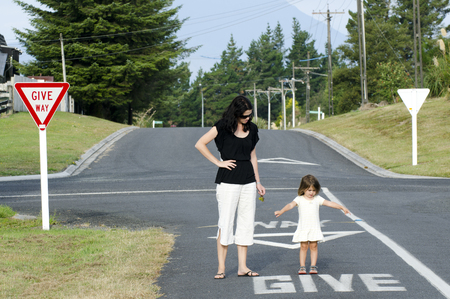 Young mother teach her daughter about traffic rules .の写真素材