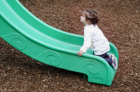 A child plays in a playground.の写真素材