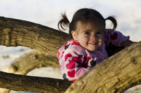 A happy little girl play in the nature during vacation.の写真素材