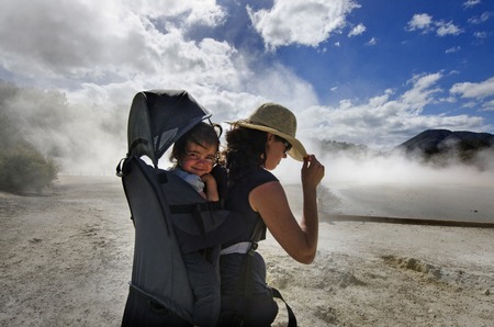 A woman travel with her baby at the Champagne Pool in Wai-O-Tapu Geothermal Wonderland, Rotorua, New Zealand.の写真素材