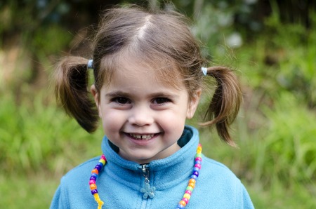 Portrait of a smiling girl in the nature. concept photoの写真素材