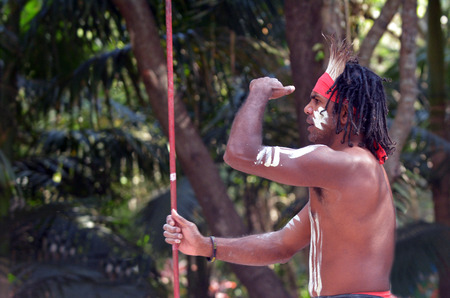 Portrait of one Yugambeh Aboriginal warrior man preform Aboriginal culture during cultural  show in Queensland, Australia.の写真素材
