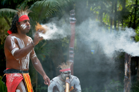 Yugambeh Aboriginal warrior demonstrate  fire making craft during Aboriginal culture show in Queensland, Australia.の写真素材