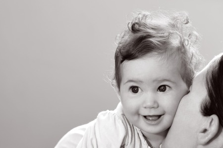 Happy baby (girl age 06 months) smiles. Concept photo childhood.copy space (BW)の写真素材