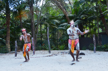 Two Yugambeh Aboriginal warriors dance during Aboriginal culture show in Queensland, Australia.の写真素材