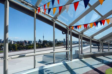 Auckland city skyline as view trough a big window glass in Auckland, New Zealand.