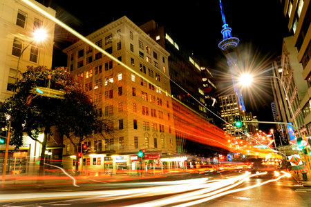 AUCKLAND,  NZL - SEP 29 2015:Traffic on Victoria Street in Auckland Downtown at night. Auckland is the country's most cosmopolitan city with the best nightlife in New Zealand.のeditorial素材