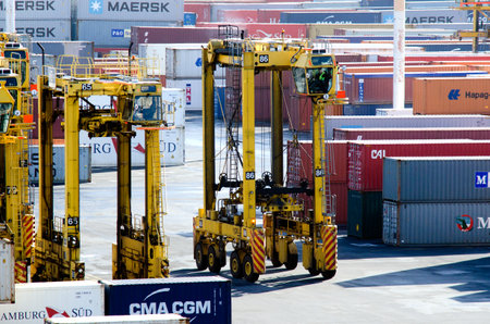 AUCKLAND,NZ - MAY 29:Straddle carriers and containers on Fergusson Wharf at Ports of Auckland on May...