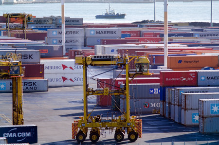 AUCKLAND,NZ - MAY 29:Straddle carriers and containers on Fergusson Wharf at Ports of Auckland on May 29 2013.It's New Zealand's largest commercial port, its turnover of more than NZ20 billion per yearのeditorial素材