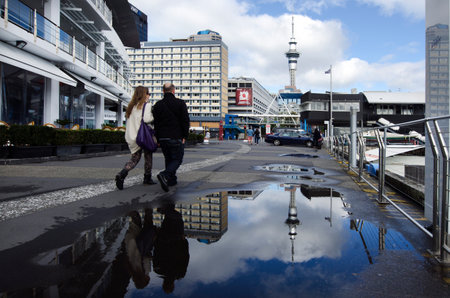 AUCKLAND - MAY 26:Couple visit at Auckland Viaduct Harbor Basin on May 26 2013.It's a former commercial harbor turned into a development of upscale apartments, office space and restaurants.のeditorial素材
