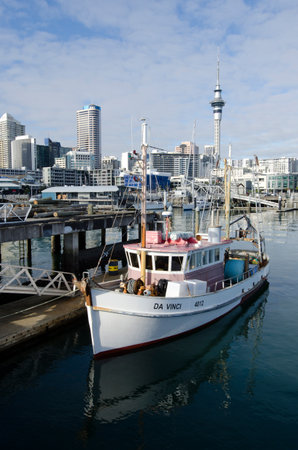 AUCKLAND - JUNE 02:Fishing boat in Auckland Viaduct Harbor Basin on June 02 2013.It's a former commercial harbor turned into a development of mostly upscale apartments, office space and restaurants.のeditorial素材