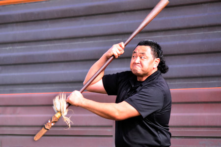 KAITAIA, NZ - AUG 15:Maori chief demonstrating Mau Rakau martial art in the street on Aug 15...