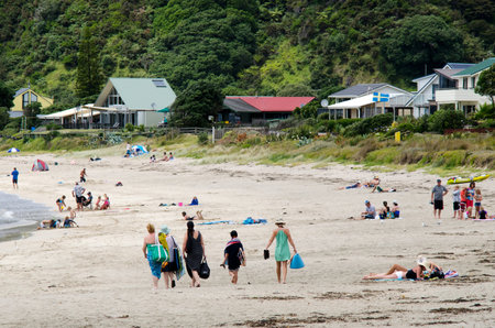 TAUPO BAY, NZ - JAN 24: Visitors in Taupo Bay on Jan 24 2014.It's a very popular travel destination in NZ located in east coast of Northland, New Zealand.のeditorial素材