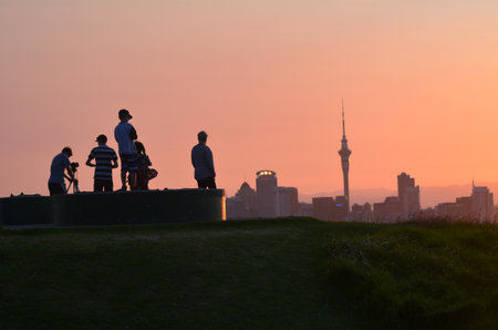 AUCKLAND, NZ - JAN 18:Visitors in Auckland  during sunset on Jan 18 2014.Auckland has been rated one of the world's top 10 cities to visit by travel bible Lonely Planet.のeditorial素材