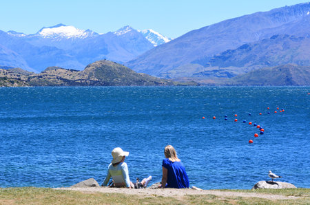 WANAKA, NZ - JAN 17: Visitors in Wanaka lake on Jan 17 2014.it's New Zealand's fourth largest lake,and estimated to be more than 300m 980ft deep at an altitude of 300 metres.のeditorial素材